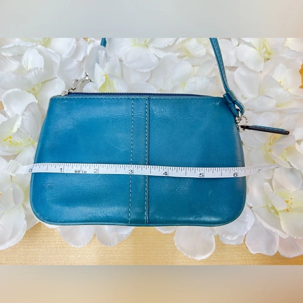 Coach Legacy Leather Small Wristlet. design is  featured during Coach’s 65th